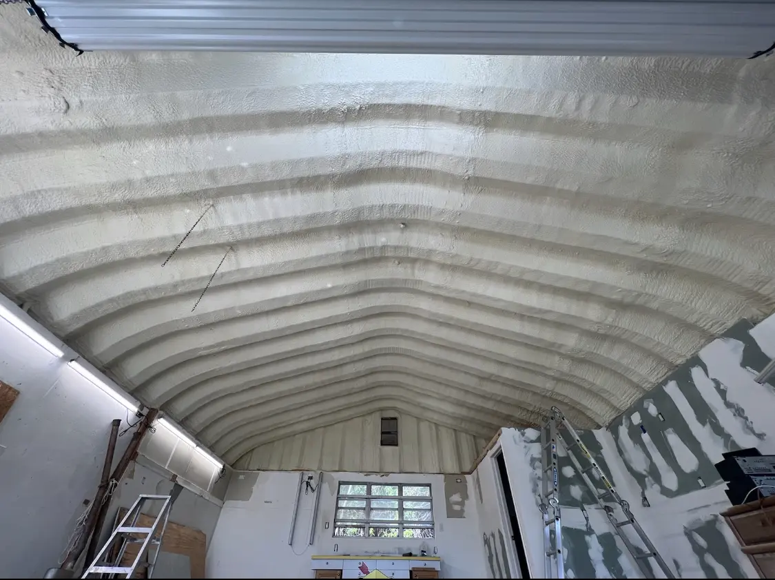 Spray polyurethane foam applied to the underside of a metal roof deck in Tanque Verde